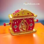 "A detailed view of a beautifully decorated Tatta Suchi plate, a symbol of cultural heritage and marital vows in Bengali weddings."