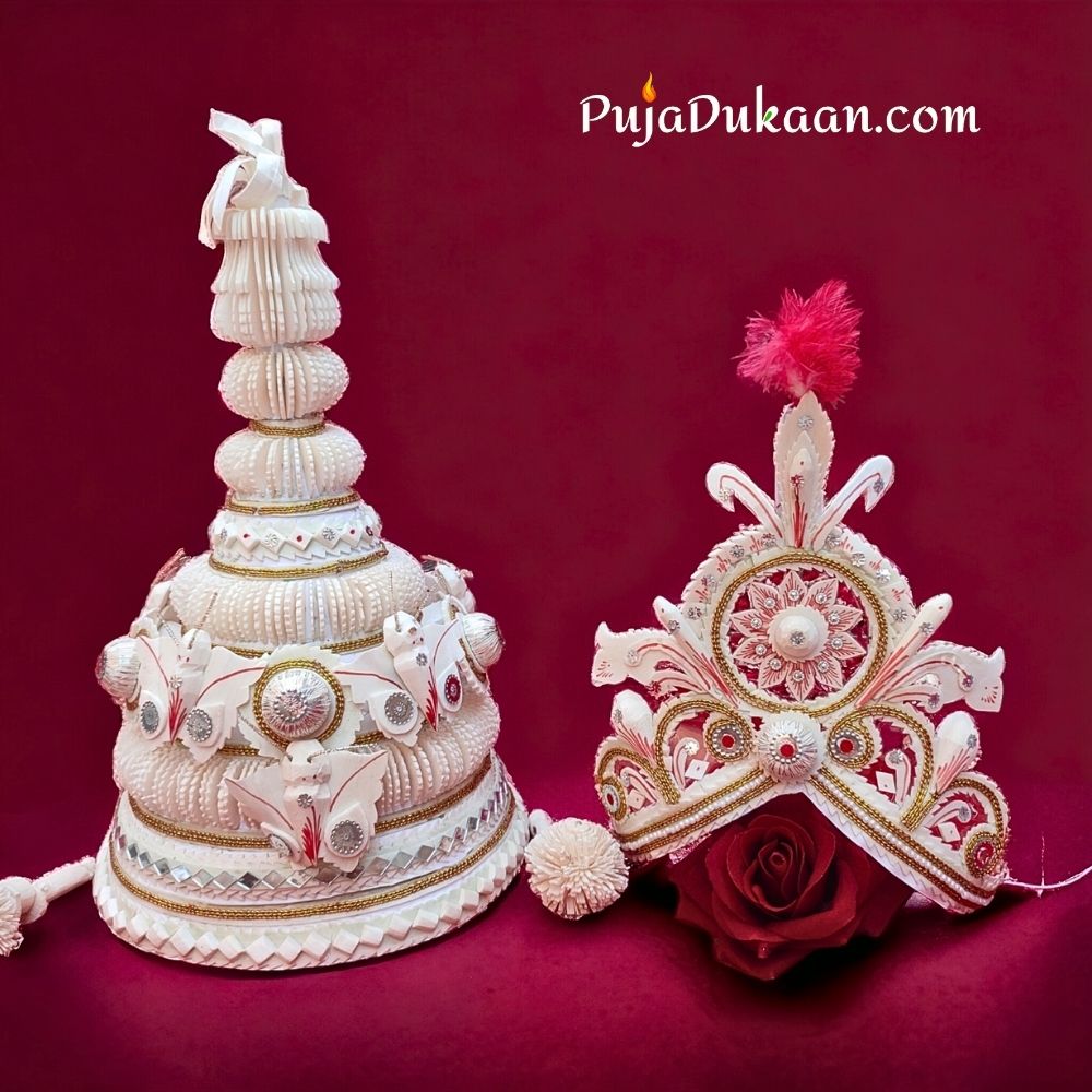 "Topor Mukut - Traditional Bengali Wedding Headgear adorned with intricate designs, crafted from sholapith, and embellished with gold foil, gemstones, and pearls, symbolizing heritage and elegance in matrimonial traditions."