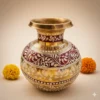 Hand-painted brass Kalshi with traditional maroon and white Kolka floral designs, 8 inches tall, displayed on a neutral beige background with marigold flowers.
